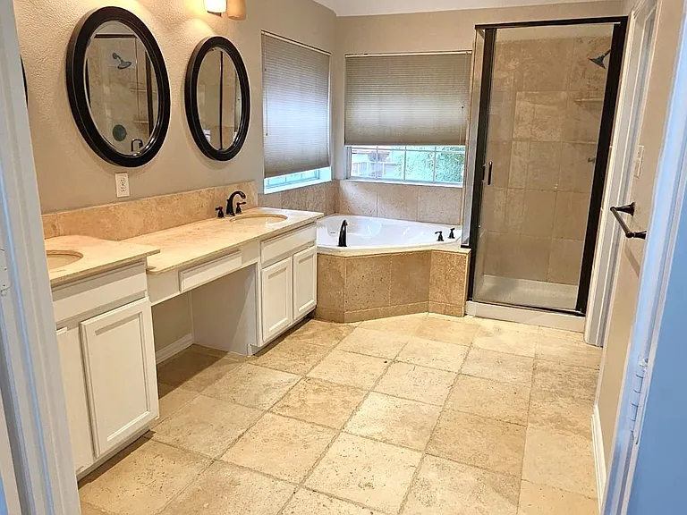Master bathroom with a big jacuzzi tub and shower
