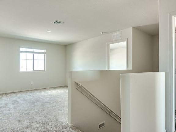 Utilize the upstairs loft as a secondary living space for the whole family.