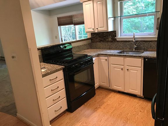 The kitchen is open to the dining and living areas and has g