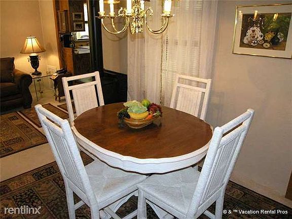 The dining table doubles as a computer center and game place