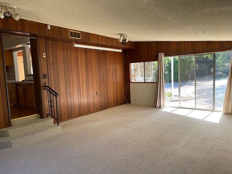 sliding glass doors to back yard, parking area