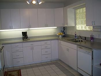 Large u shaped kitchen with lots of cabinets and countertops and all the appliances stay.
