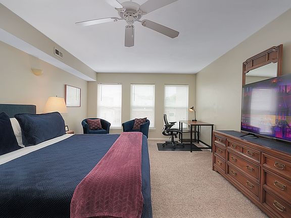 Second floor bedroom with work area and private bath.