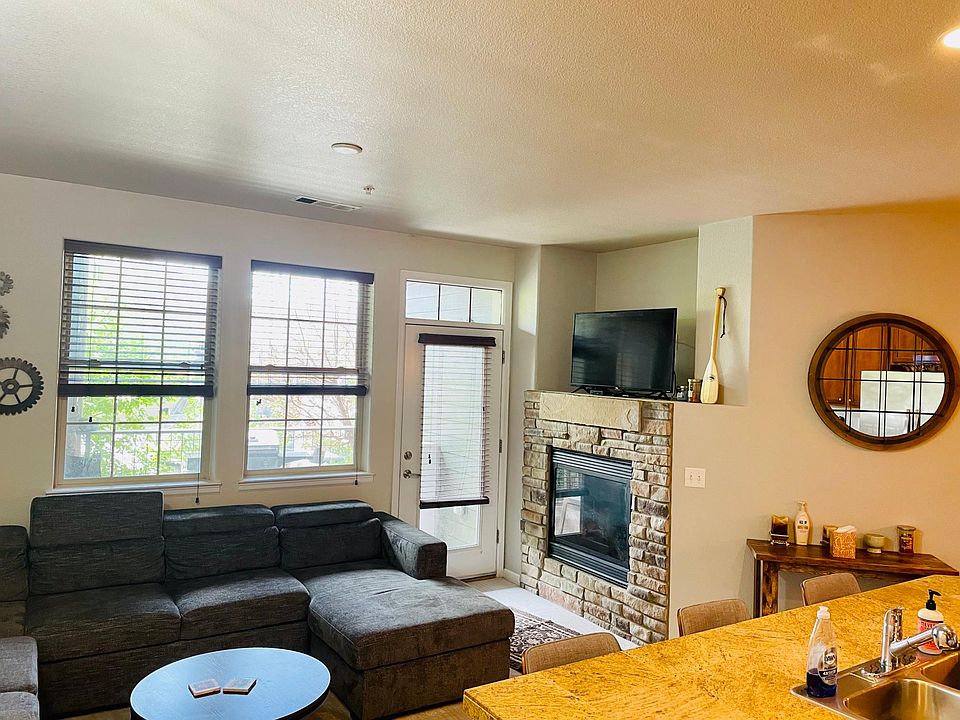 Living room with fireplace and walkout patio.