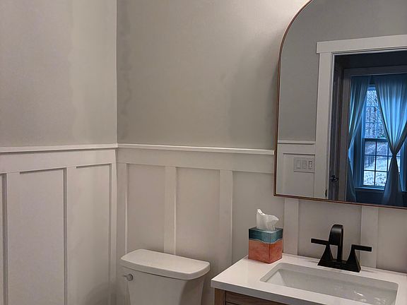 1st floor bathroom with door that separates shower
