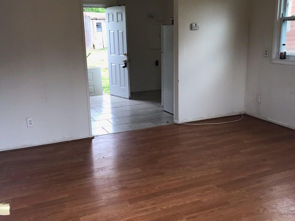 view from front entry door into living room and into kitchen