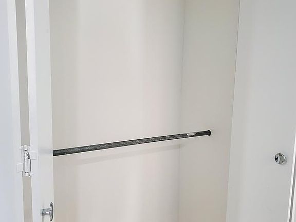 Cloak closet by Foyer