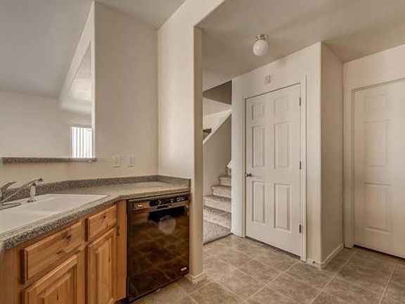 Kitchen with additional storage under the stairs Kitchen has dishwasher, oven, fridge, microwave, and storage pantry - appliances have been well maintained. Lighting has been upgraded throughout the home.