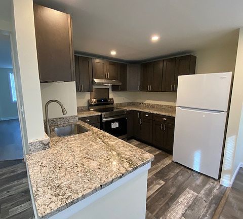 Kitchen with new appliances and brand new granite countertops