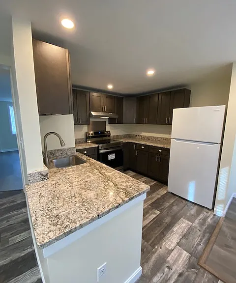 Kitchen with new appliances and brand new granite countertops
