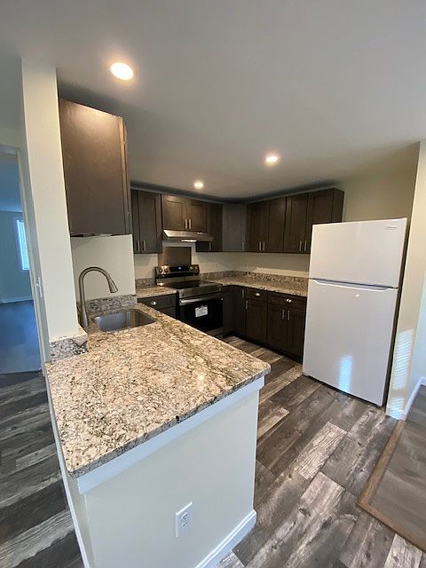 Kitchen with new appliances and brand new granite countertops