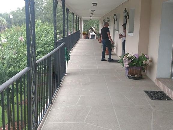 Second story big porch facing Riverside. I am located at the end, and closed in.