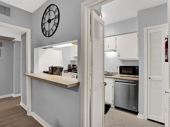 A view of kitchen and breakfast bar.