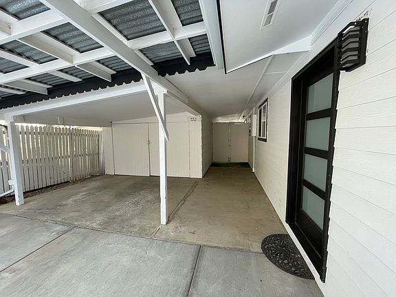 Carport and access to back patio and yard.
