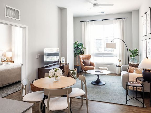 Upgrade Collection living area and dining area with hard surface vinyl plank flooring (Representative photo)