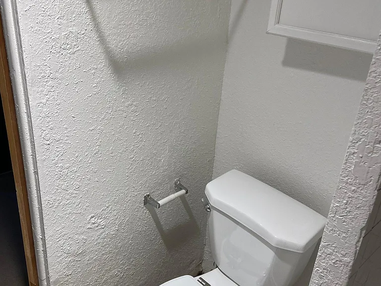 Bathroom looking right to left photo #3.