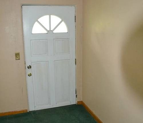 The home has two entrances.  One into the front living room and the other is a breezeway between the house and the garage.