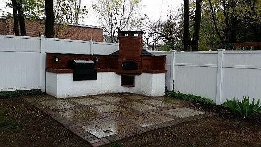 Patio and outdoor kitchen with pizza oven