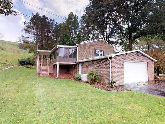 Home boasts a gorgeous 3-season room and covered composite deck. Wide driveway has ample parking for all of your guests.