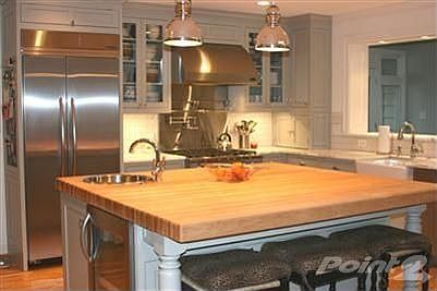 The kitchen is the true heart of the home. No expense was spared: custom cabinetry, marble counters,