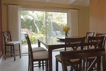 Dining room with sliders to sunny garden