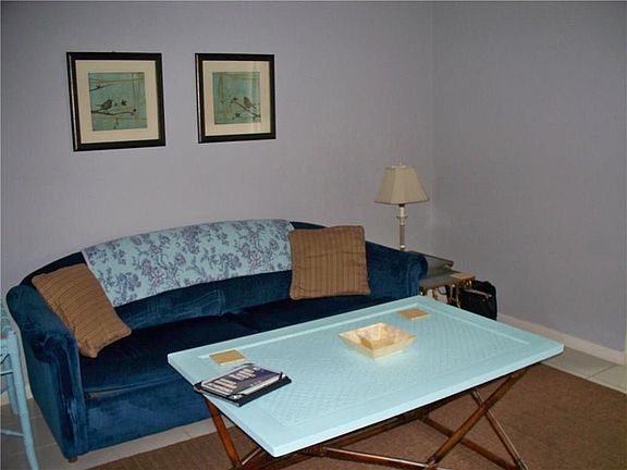 Living room.   Tile is through the unit except in master bedroom is carpeted
