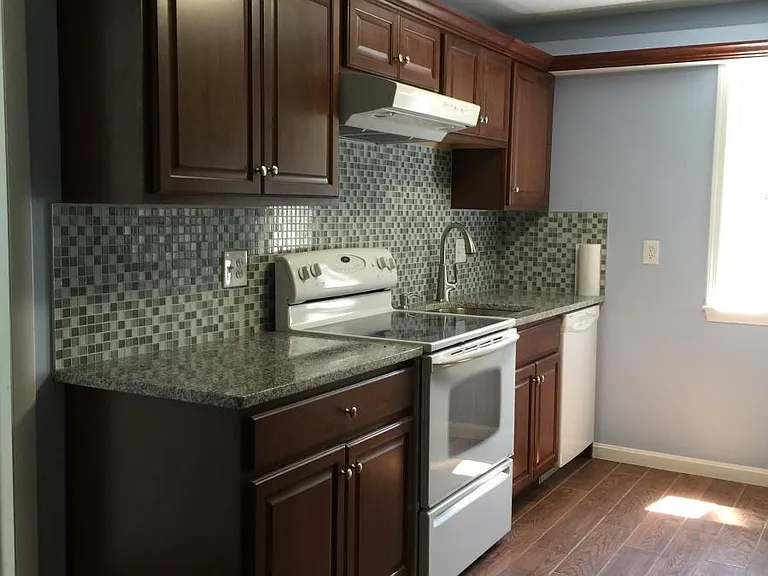 Kitchen with granite counter top and backsplash