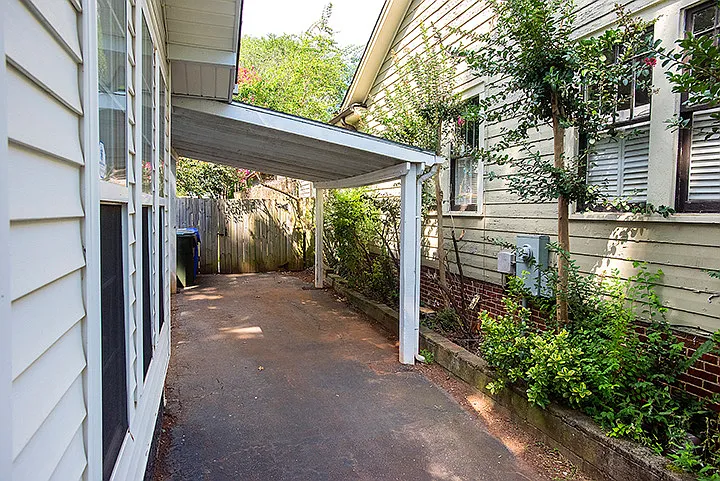 carport runs along side of home - there is also street parking