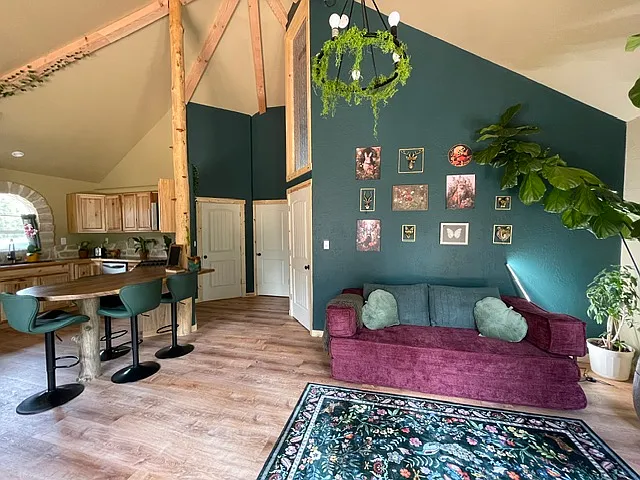 Main living area with kitchen off to the left. The unique octagon design allows for high vaulted ceilings in every room.