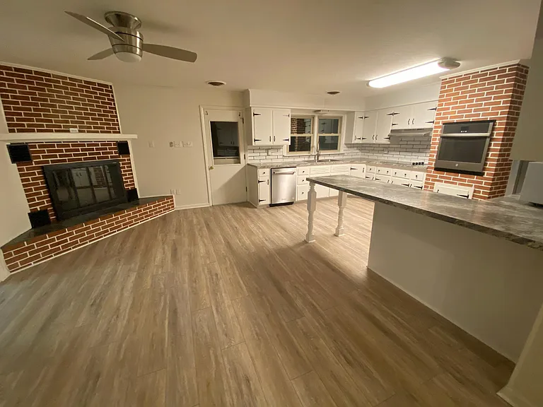 Large kitchen and eating area with gas fireplace