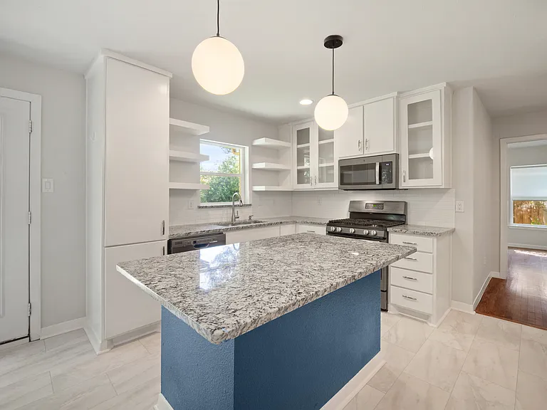 Kitchen with seated island.
