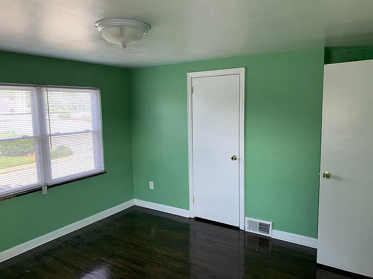 Main bedroom front windows and door to large closet