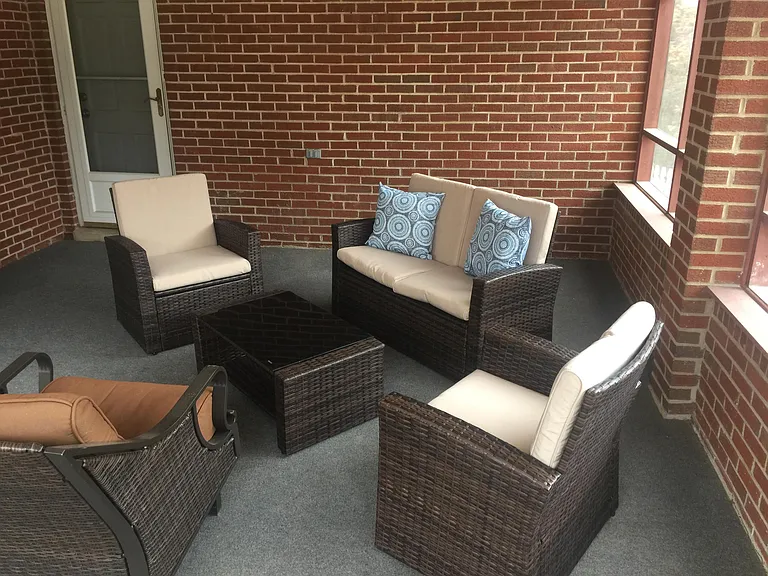 Enjoy the outdoors! A screened in porch off kitchen