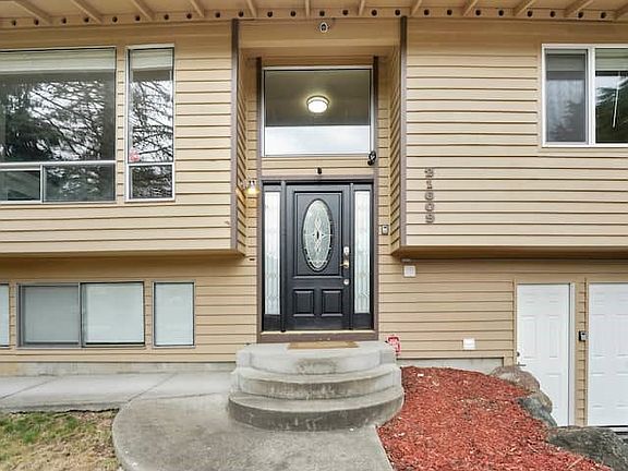 Front of the house - Access to the upper unit is black door up the stairs