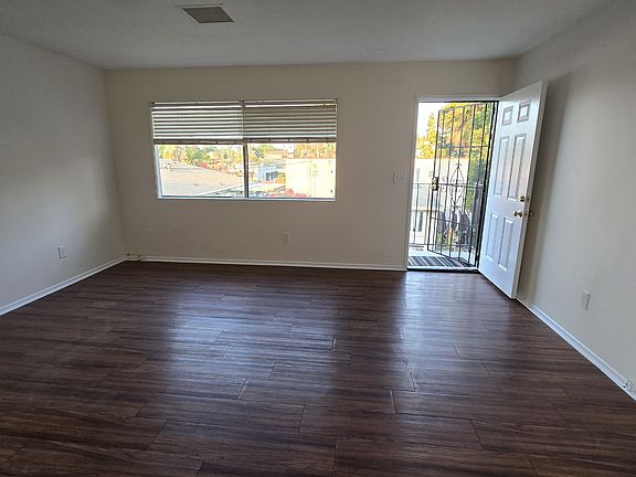 Living room area, opens up to front balcony.