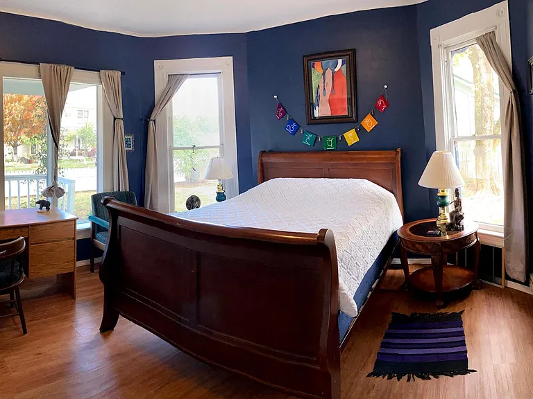 Off the living room is this warm and welcoming room. Queen sized sleigh bed with pleanty of room on either side and room for a desk provided for those renting furnished.