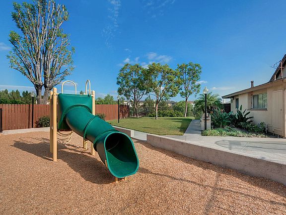 Playground surrounded by mulch.