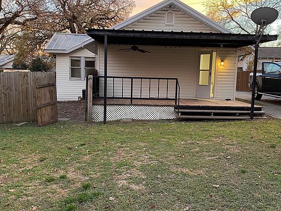 Back porch and large fenced yard.