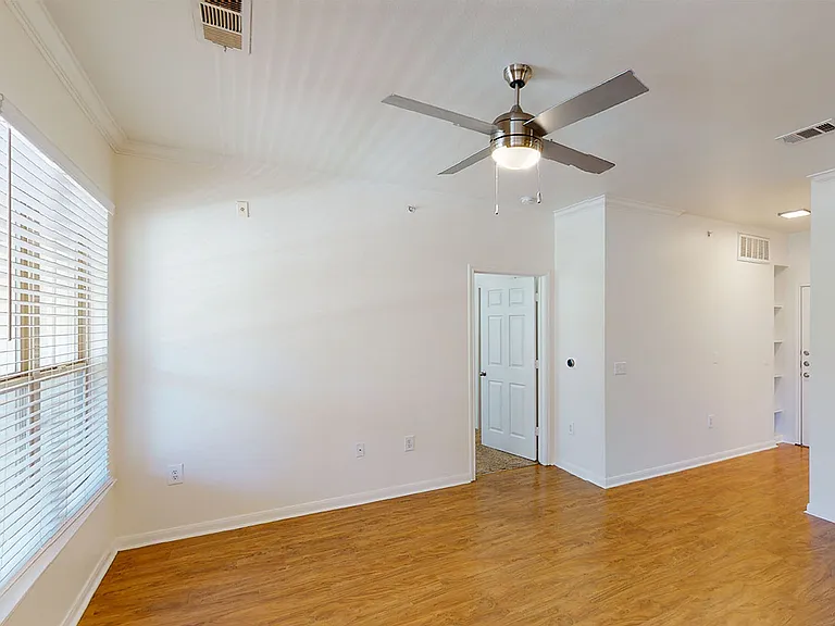 Apartment living room with wood-style flooring.