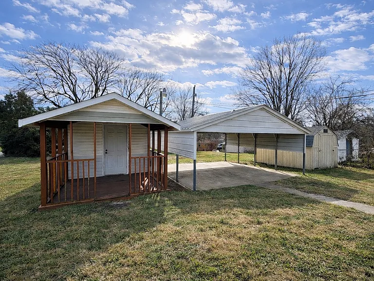 Rear exterior carport and storage shed