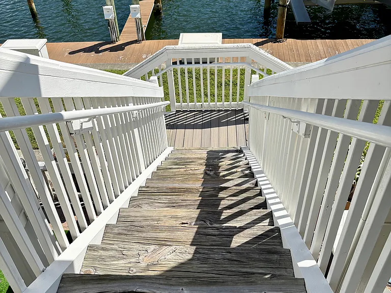 Stairs to waterfront walkway from unit