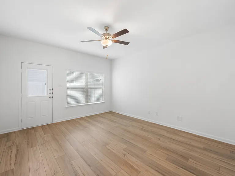 The family room with a large window for natural light.