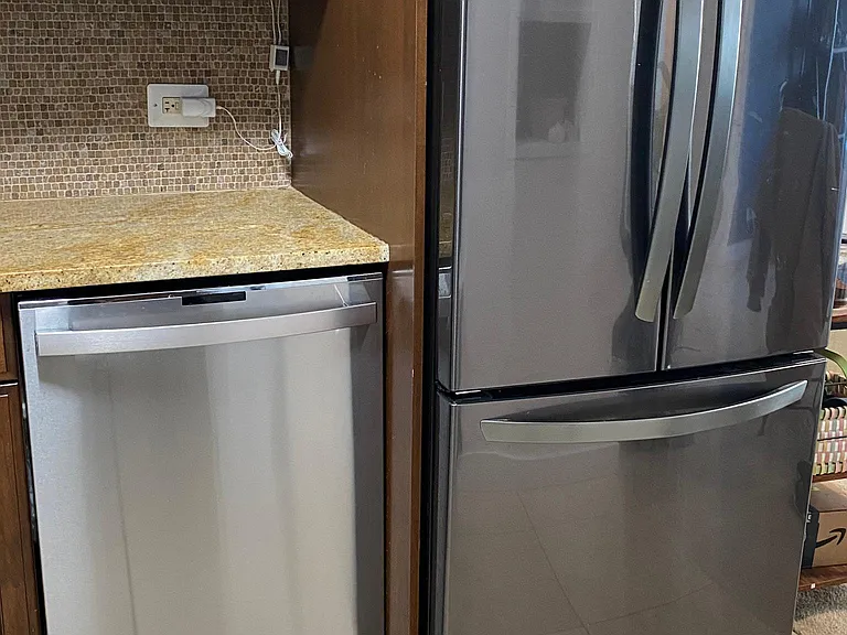 Old Photo before new paint. Contractors installed new Dishwasher w/ all Stainless interior / exterior w/ disposal. "AND BONUS" top left Contractors belongings during recent update :) lol.