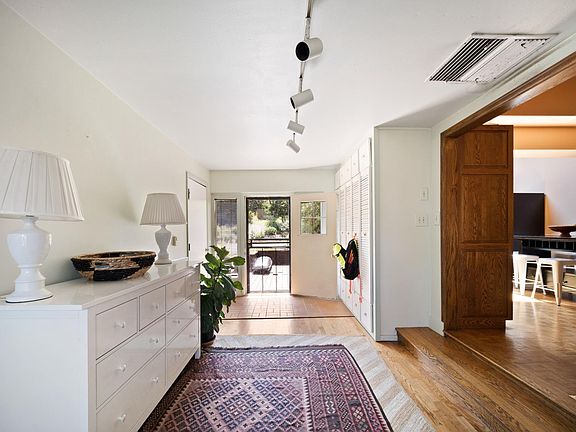 Informal entry opens to finished Breezeway / bonus room
