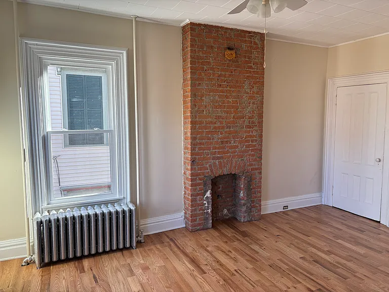 Master Bedroom with Brick Fireplace