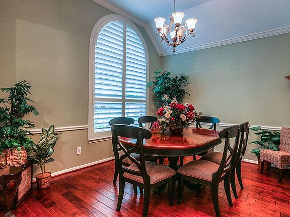 Formal Dining showing gleaming floors and custom Plantation Shutters.