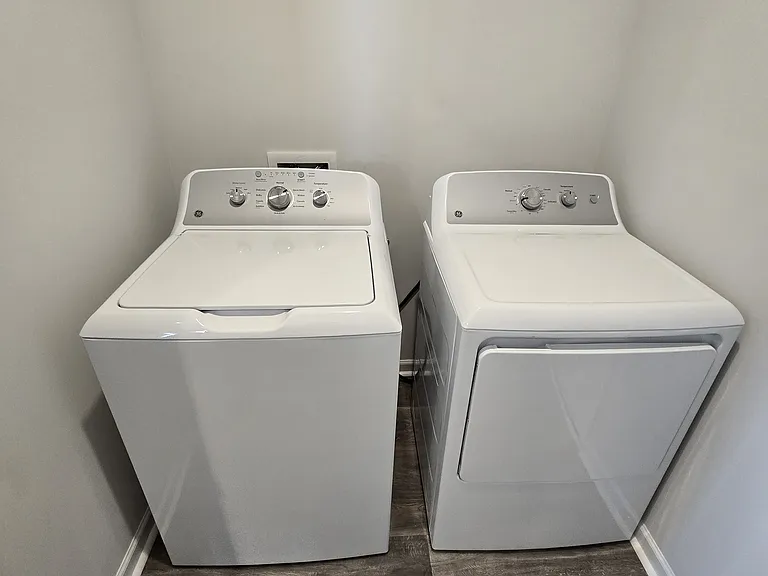 Separate Laundry room with washer on first floor off of kitchen