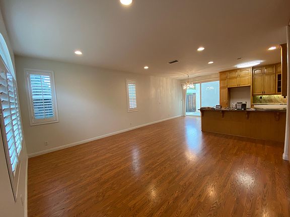 Living room adjacent to the kitchen and dining area.