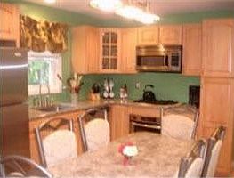 Expanded Kitchen - Granite counters, high end appliances, and maple cabinets