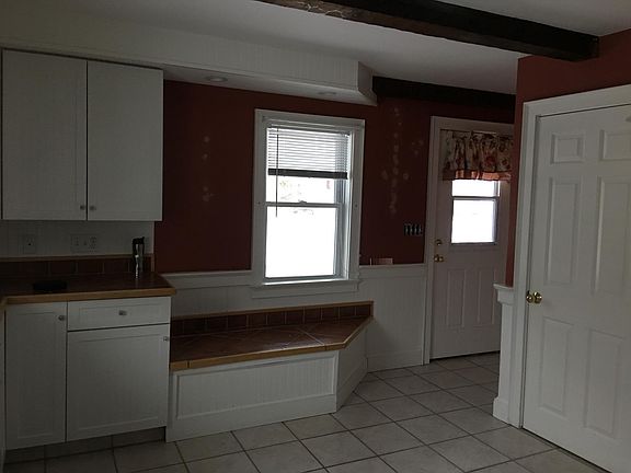 View of front door (Bench seat lifts up for added storage)